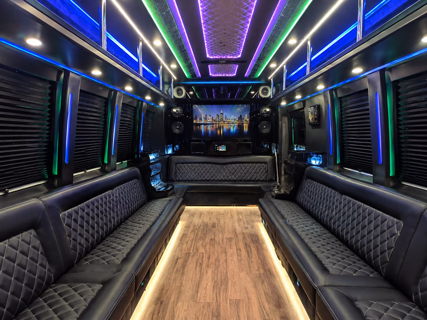 Friends laughing during a party bus celebration in Winston-Salem