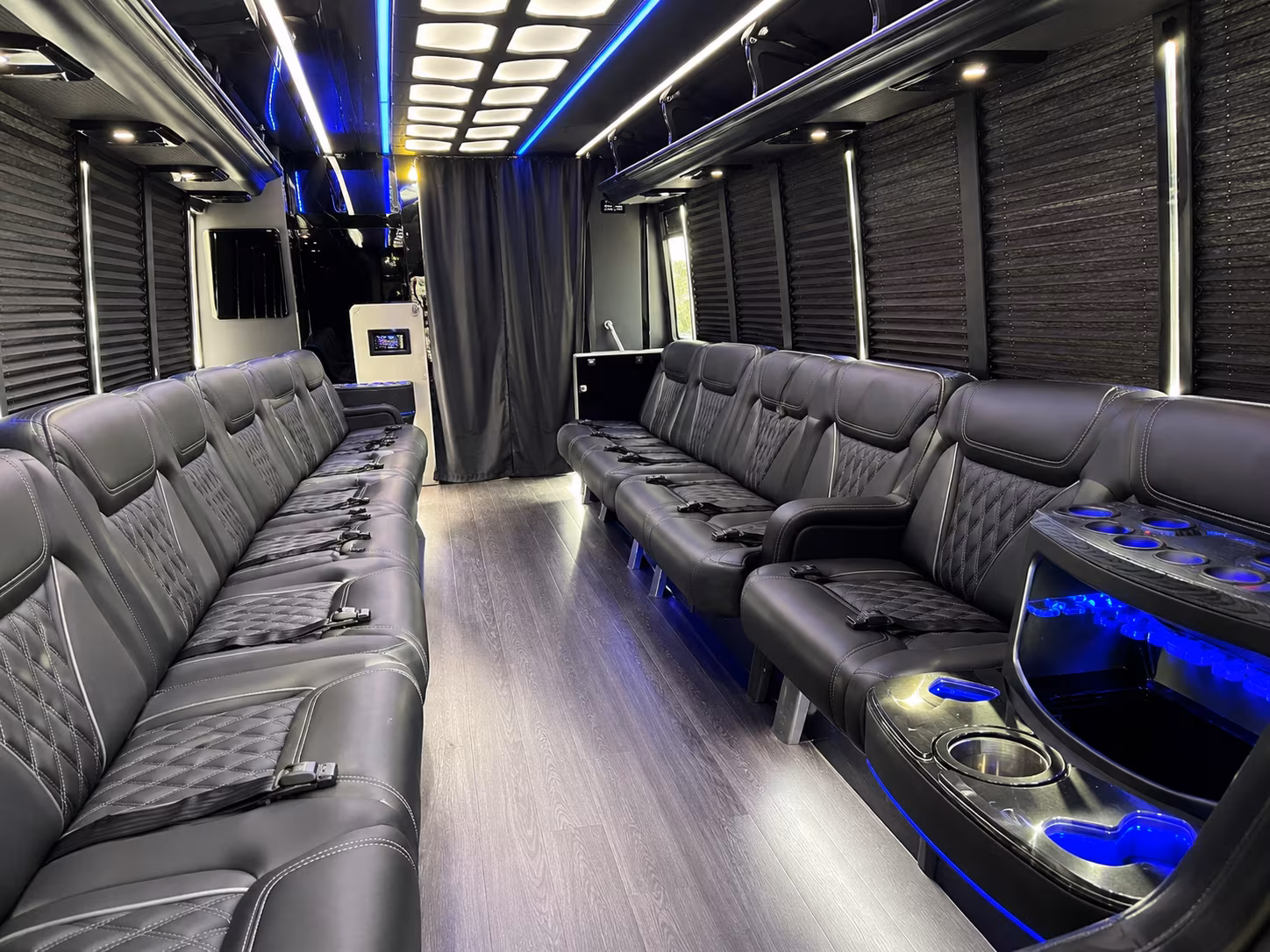 Group beside a Mercedes Sprinter limo in Winston-Salem